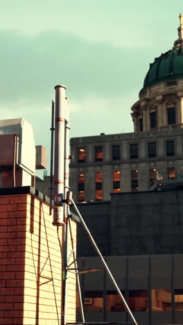 city rooftop with antenna and building dome