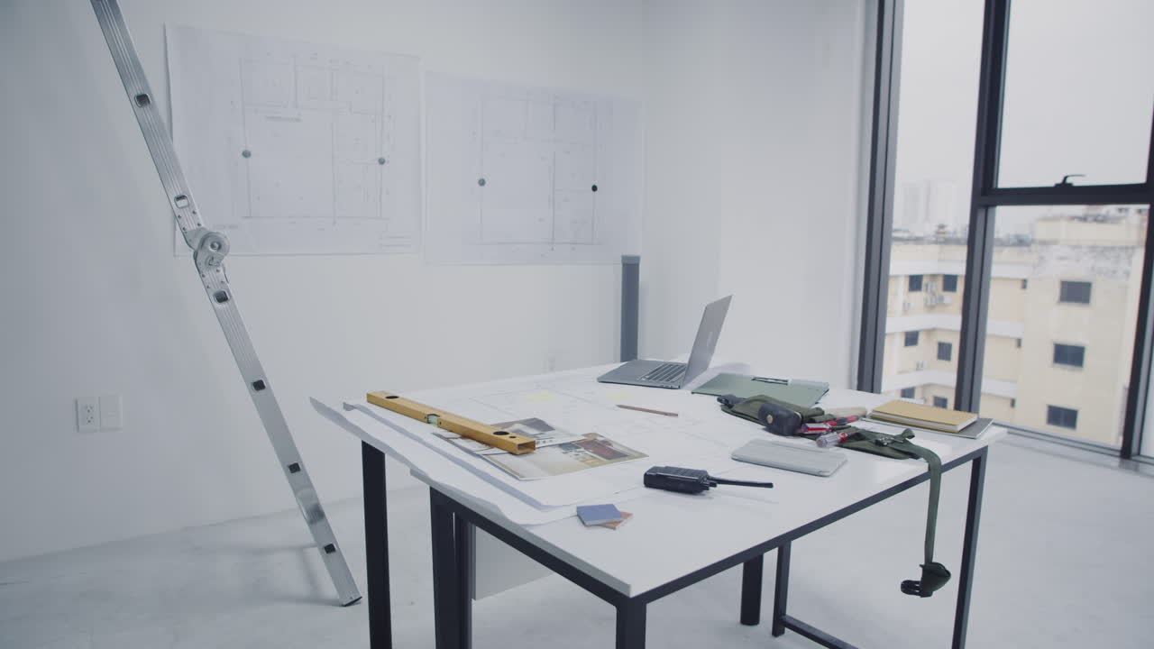 Part of Table of Architects Designing Room in New Building