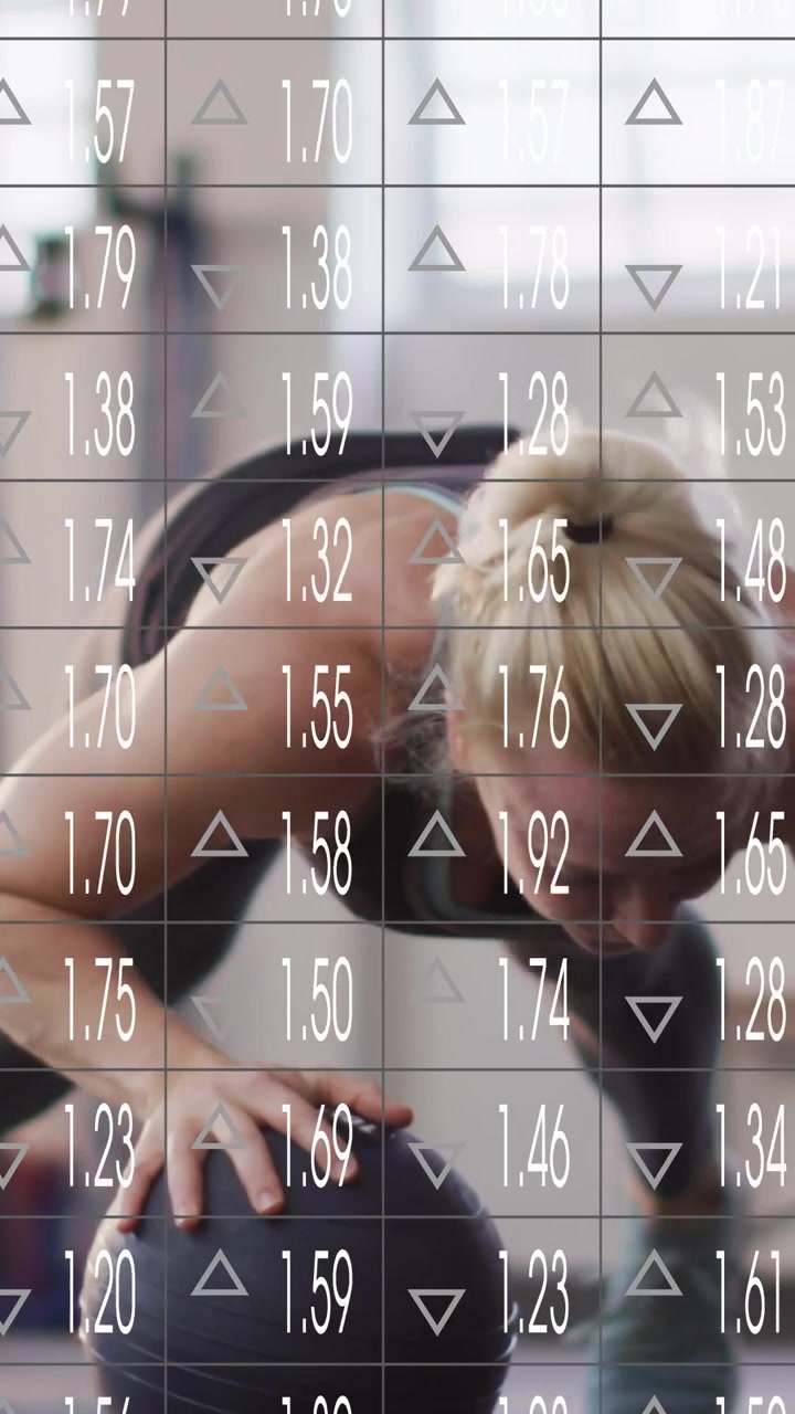 Vertical video: Woman reaching for med ball doing pushups for fitness while faint data grid overlay