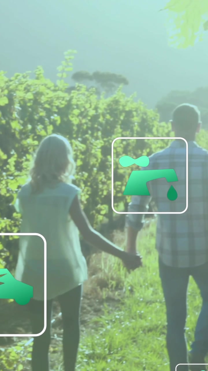 Animazione di icone digitali ecologiche e di energia verde su persone che si tengono per mano in un campo