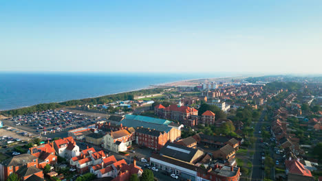 Explore-Skegness,-Lincolnshire,-from-above-in-this-mesmerizing-aerial-video,-featuring-its-stunning-coastline-and-bustling-tourist-scene