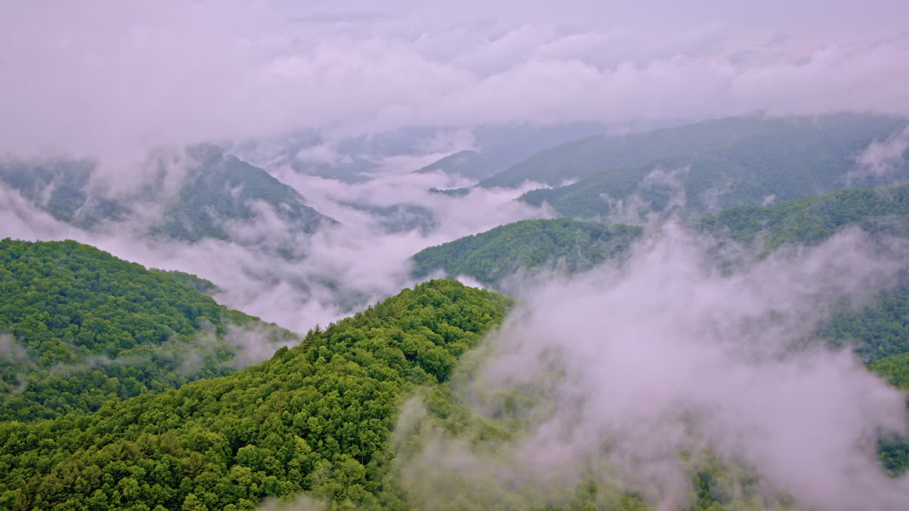 Sweeping drone view of the foggy embrace of the Great Smoky Mountains