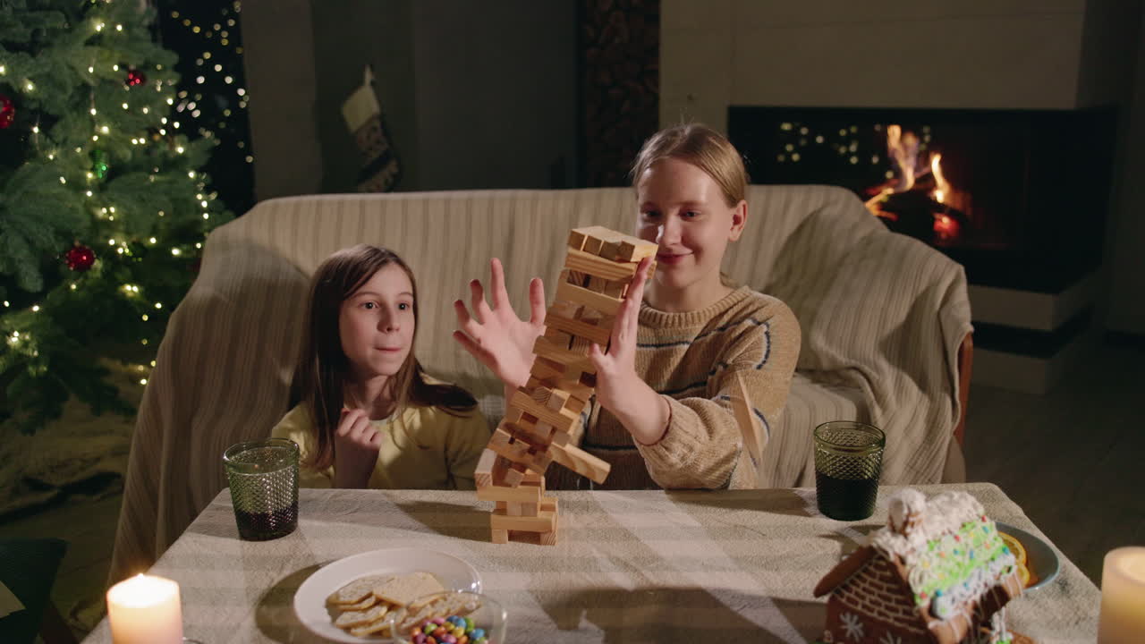 Children playing Jenga at Christmas
