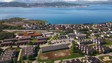 tromso neighborhood on banks of fjord in norway, scenic aerial view