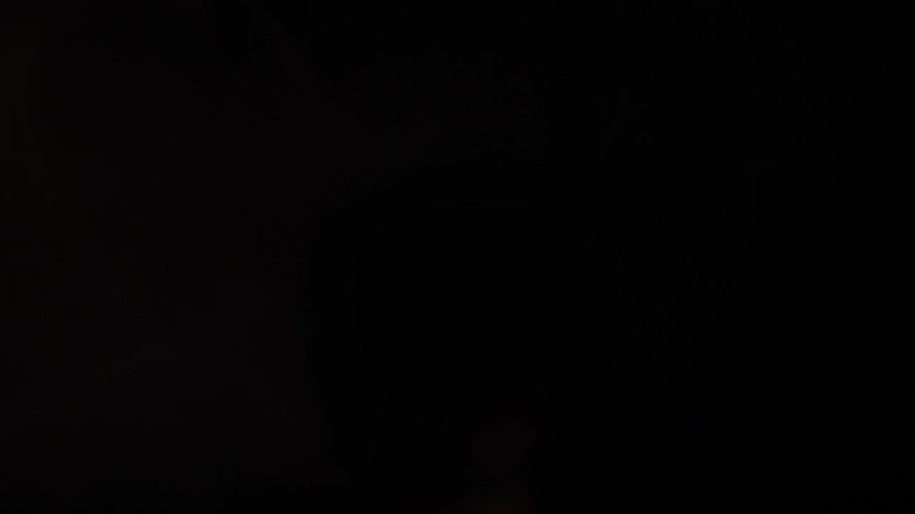 Sudden Flash of Light with Billowing Smoke on Black Background