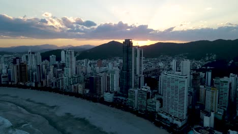 Aerial-view-of-Balneario-Camboriu-at-sunset-from-the-beach