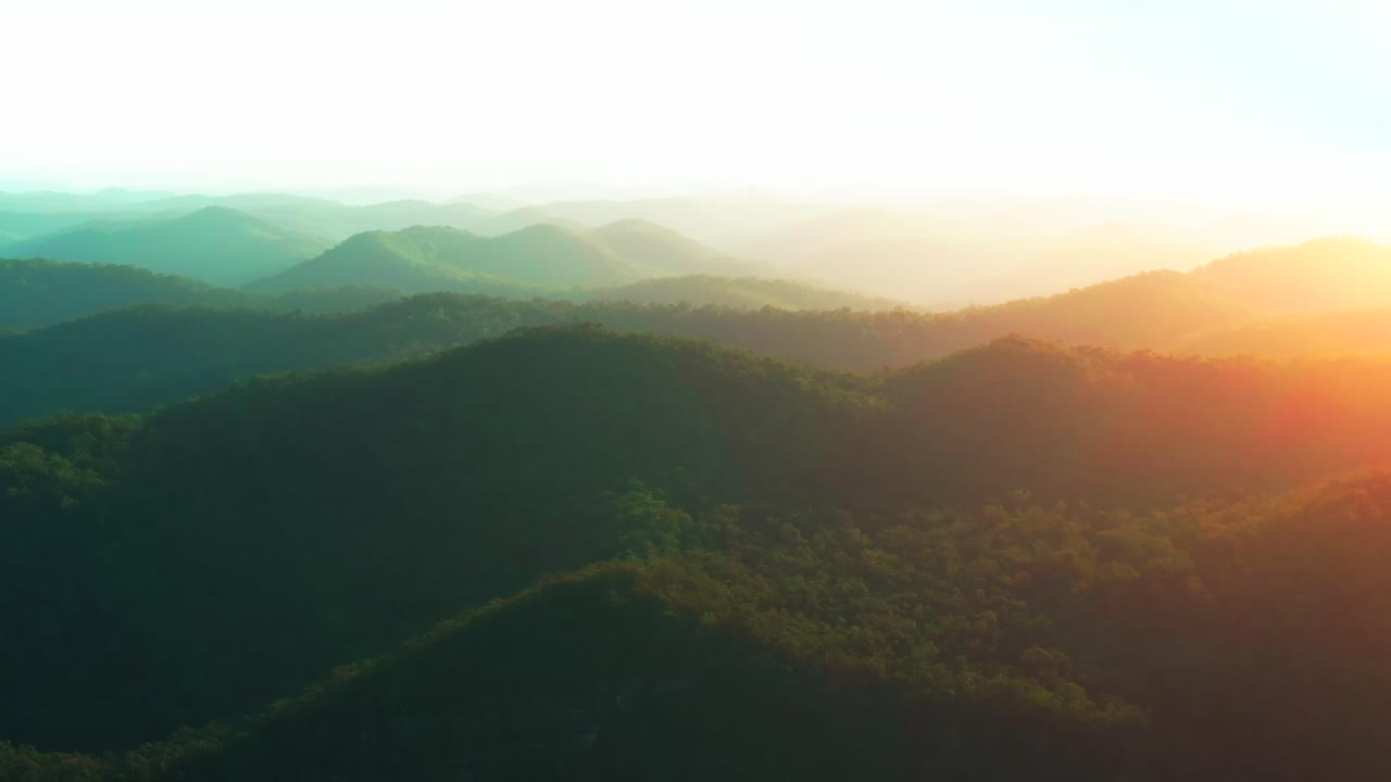 Outback vibrant orange sun flare mountain layers sunset sunrise aerial drone horizon golden hour Lower Mangrove Hawkesbury River Creek NSW Sydney Blue Mountains Australia summer circle right motion