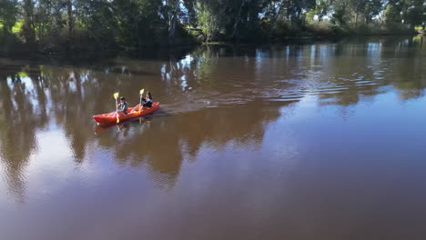 People-in-boat-for-exercise,-sports-and-lake