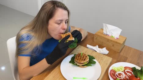 woman eating a delicious burger