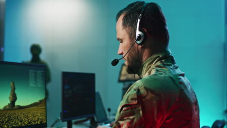 military personnel in a control room monitoring satellite imagery