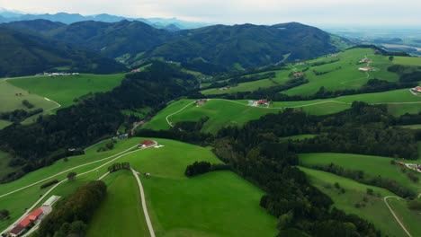 beautiful small town of kürnberg, austria, surrounded by lush green hills and alps mountains. pan right reveal shot