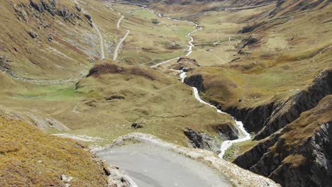 mountain stream flowing in verdant valley