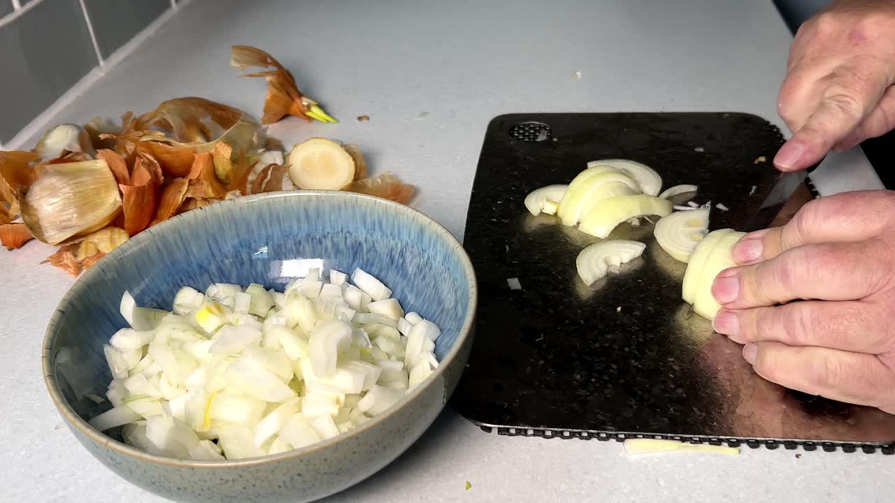 Whole white onions chopped and placed in a bowl