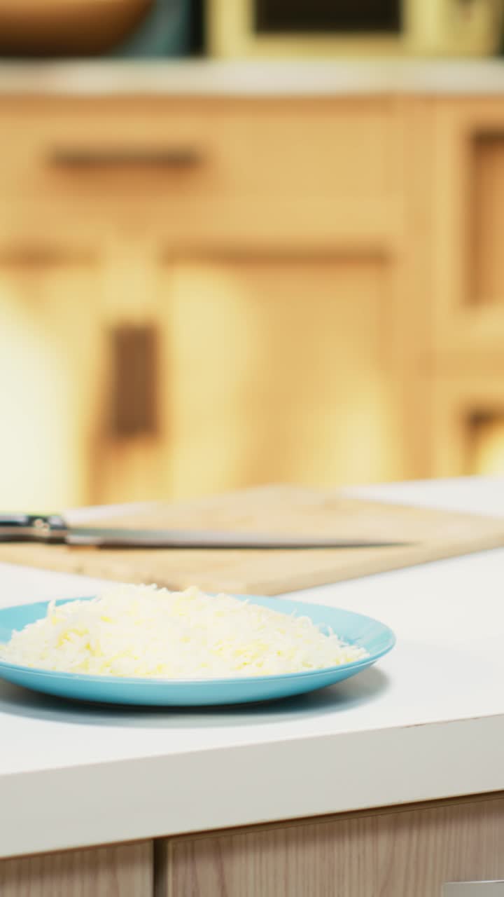 Vertical Video Comfortable kitchen setup with pizza ingredients on a modern countertop
