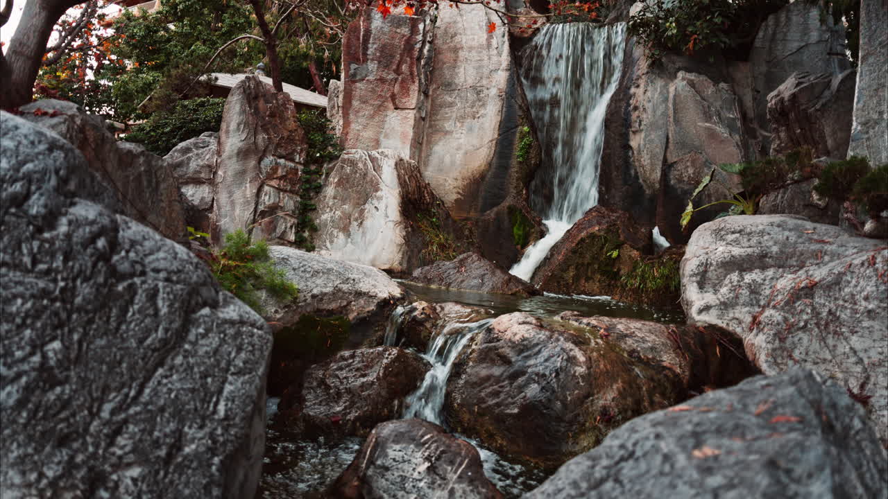 View of the a small waterfall in the Japanese Gardens in Monaco