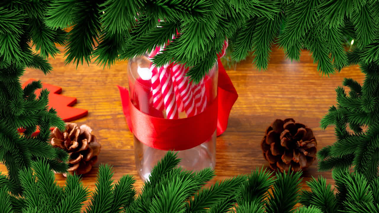나무 배경 에 사탕 을 넣은 항아리 위 에 크리스마스 소나무 프레임 의 애니메이션