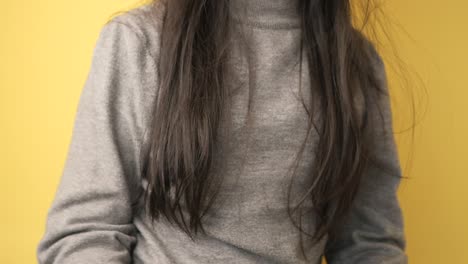 woman in grey turtleneck sweater