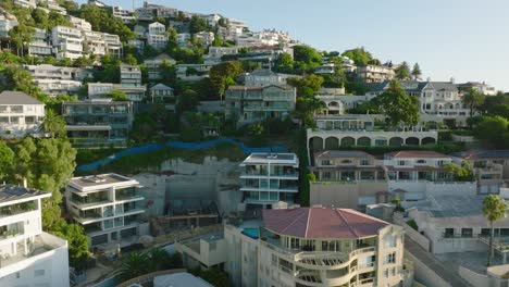 residences and properties in tourist destination. backwards reveal of development in steep slope. cape town, south africa