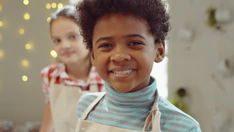 portrait of happy boy on culinary masterclass