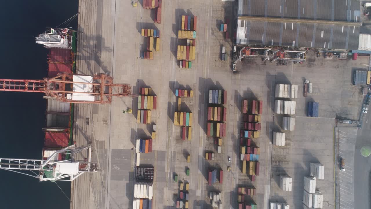 Cargo Containers and Moving Trucks in a Sea Port