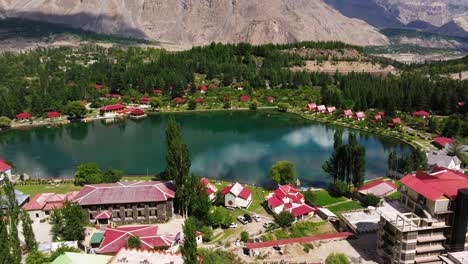 aerial boom shot reveals shangrila lake, skardu, pakistan on beautiful summer day