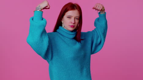 girl showing biceps, feeling power strength to fight for rights, energy to gain success win fight