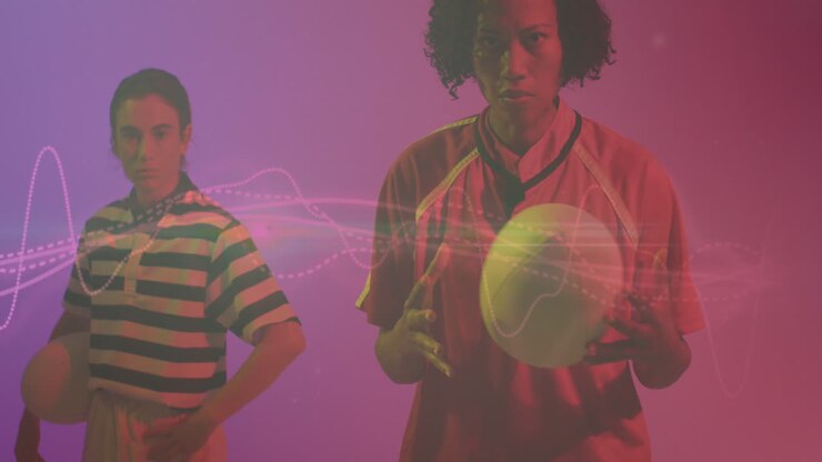 Animation of neon light trails over female rugby players on neon background