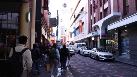 people walking in melbourne's chinatown street