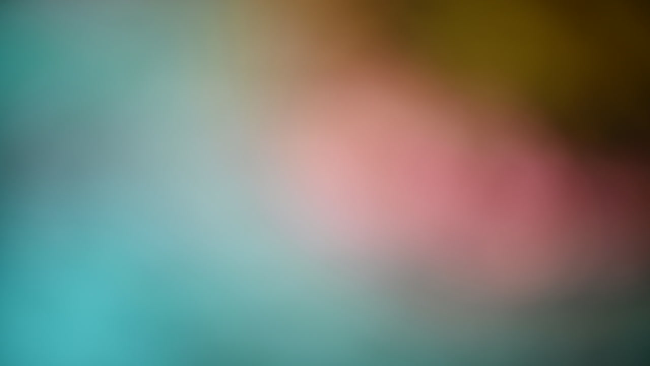 Abstract blurred background with blue, pink, and brown hues