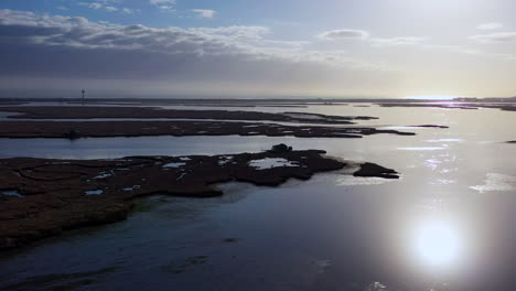 An-aerial-shot-over-Baldwin-Bay-near-Freeport,-NY-during-sunset