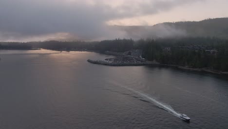 Aerial-View-of-a-small-secluded-town-on-the-Pacific-Ocean-Coast-during-a-cloudy-summer-sunrise