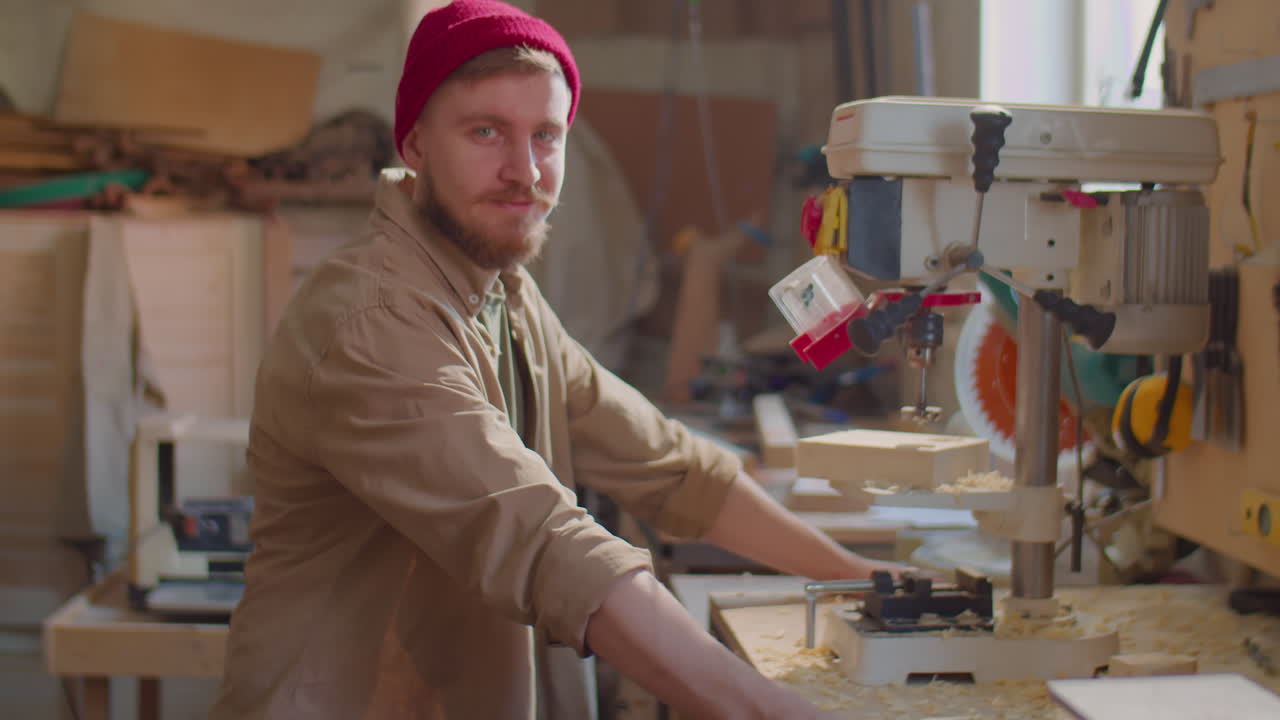 Portrait of Cheerful Woodworker in Carpentry Workshop