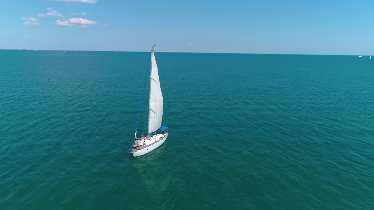 Seascape with sail boat. Aerial view of lonely ship sailing in the open sea