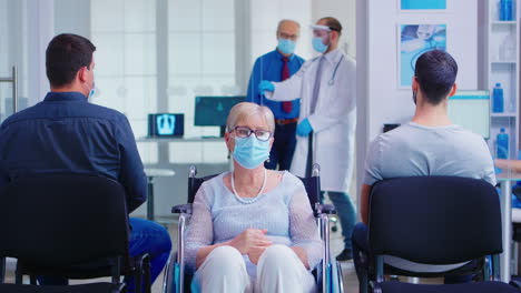 worried disabled woman in hospital waiting area