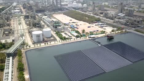 aerial view of floating solar farm or solar panels on the water in industrial estate.