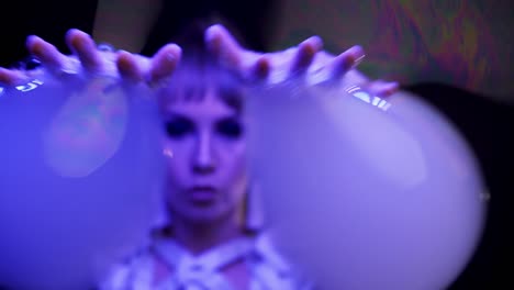 close-up: female does tricks with soap bubbles, plays with bubbles, pulls them with hands