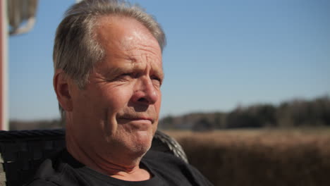 Close-Portrait-of-Old-senior-man-outdoors-shaking-head-answering-no