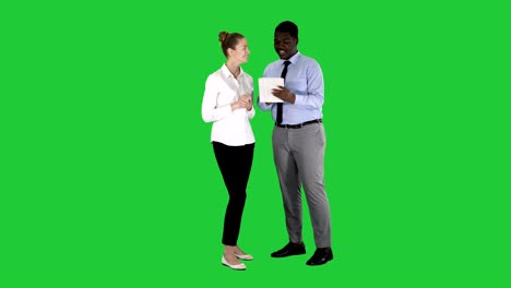 modern business people working on a tablet on a green screen, chroma key