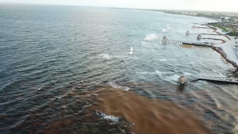 Aerial-View-Of-Resort-With-Jetty-At-Vidanta-Riviera-Maya,-Quintana-Roo,-Mexico---drone-shot