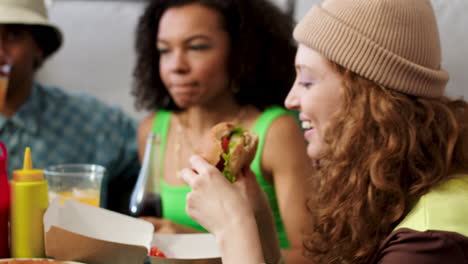 three friends eating at home