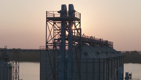 The-sun-rises-behind-a-rice-mill-in-Arkansas-on-the-Arkansas-River