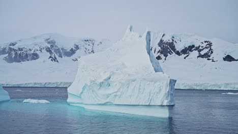 Antarctica-Iceberg-Mountains-and-Ocean,-Beautiful-Dramatic-Blue-Coastal-Landscape-and-Seascape-on-Antarctic-Peninsula-Coast,-Icy-Winter-Sea-Scene-with-Ice