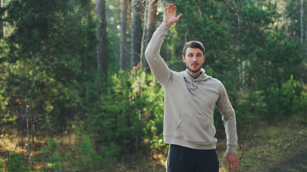 Man Stretching Outdoors in Forest