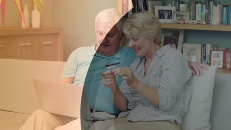 animación de formas sobre una pareja caucásica mayor que usa una computadora portátil para comprar en línea
