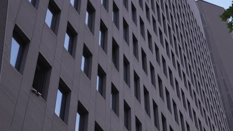 a close-up view of a modern office building with a grid-like window pattern