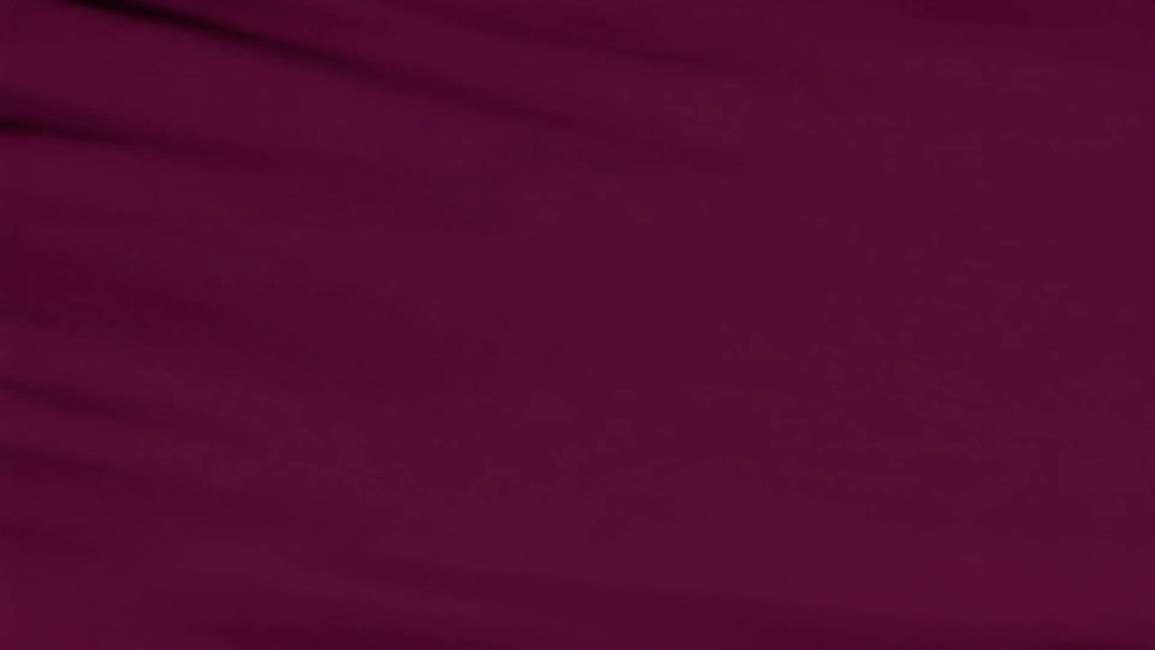 Abstract Background of Dark Purple Fabric Waving in the Wind