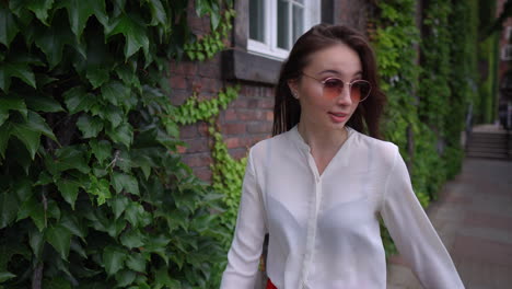 young woman walking in a city