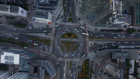 Aerial-birds-eye-overhead-top-down-panning-view-of-bad-traffic-situation-in-downtown.-Clogged-multilane-roads-in-large-intersection.-Warsaw,-Poland