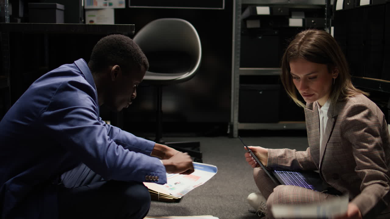 Business professionals analyzing data in an office filing room