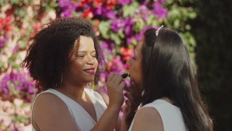 happy bride applying make up on her soulmate and then kissing her before wedding ceremony